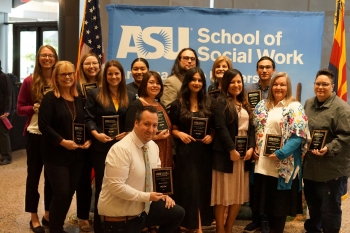 Recipients of the 2023 ASU Social Work Month Awards smile and hold their award plaques 